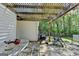 Outdoor patio with stone floors, pergola, grill, table, and a view of the backyard at 4735 Rabbit Farm Rd, Loganville, GA 30052