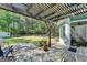 Outdoor patio with stone floors, pergola, and a view of the large, fenced backyard at 4735 Rabbit Farm Rd, Loganville, GA 30052