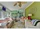 Bright sunroom featuring stone floors, large windows, comfortable seating, and stylish décor at 4735 Rabbit Farm Rd, Loganville, GA 30052