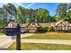 Front of house featuring Tudor accents, mailbox and green grass at 335 Jeff Davis Pl, Fayetteville, GA 30214