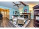 Bright and airy living room with a fireplace, ceiling fan, and hardwood floors at 335 Jeff Davis Pl, Fayetteville, GA 30214