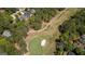 Aerial view of a green golf course and trees with scattered houses in Villa Rica, GA at 4014 Golfview Dr, Villa Rica, GA 30180