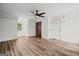 Bright bedroom boasts sleek hardwood floors and a modern ceiling fan for added comfort at 4014 Golfview Dr, Villa Rica, GA 30180