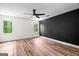 Spacious bedroom featuring wood floors, natural light, and modern accents at 4014 Golfview Dr, Villa Rica, GA 30180