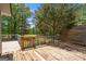 Spacious deck with a charming wooden gate overlooking a serene golf course and lush greenery at 4014 Golfview Dr, Villa Rica, GA 30180