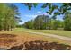 Scenic view of a well-manicured golf course surrounded by lush trees and clear skies at 4014 Golfview Dr, Villa Rica, GA 30180