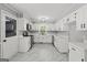 Updated kitchen featuring white cabinets, granite countertops, and stainless steel appliances at 4014 Golfview Dr, Villa Rica, GA 30180