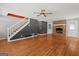 Open living room with hardwood floors, fireplace, and staircase at 4014 Golfview Dr, Villa Rica, GA 30180