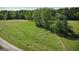 Aerial view showing open grazing land with livestock at 201 Little New York Rd, Carrollton, GA 30116