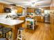 A sunlit kitchen boasts light countertops, hardwood floors, an island, and ample storage space at 201 Little New York Rd, Carrollton, GA 30116