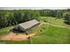 Aerial view of large outbuilding on a vast green lot, perfect for storage or a workshop at 201 Little New York Rd, Carrollton, GA 30116