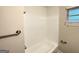 Clean tub and shower in bright, tiled bathroom at 2361 Collier Dr, Decatur, GA 30032