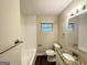 Updated bathroom featuring granite countertop and tub at 2361 Collier Dr, Decatur, GA 30032