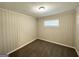Small bedroom with neutral carpet and walls at 2361 Collier Dr, Decatur, GA 30032