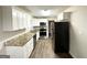 Contemporary kitchen with granite countertops, updated appliances and white cabinets at 2361 Collier Dr, Decatur, GA 30032