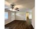 Bright living room featuring new vinyl flooring, a ceiling fan, and a large window at 2361 Collier Dr, Decatur, GA 30032