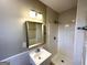 Bathroom showcasing a tiled shower and vanity, with a mirror, in a well-lit space at 2818 Lynda Pl, Decatur, GA 30032