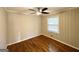 Cozy bedroom with hardwood floors, neutral walls, and a ceiling fan at 2818 Lynda Pl, Decatur, GA 30032