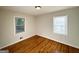This bedroom features hardwood floors and two windows that let in natural light at 2818 Lynda Pl, Decatur, GA 30032