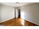 Bedroom showcasing hardwood floors and an open door to another room at 2818 Lynda Pl, Decatur, GA 30032