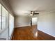 Bright living room with large windows and original hardwood floors at 2818 Lynda Pl, Decatur, GA 30032