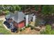Overhead view of the brick home highlighting large backyard, mature trees and storage shed at 65 Jacksons Vly, Sharpsburg, GA 30277