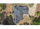 Aerial view of the property showing the roof, backyard, shed, patio and the home's location on the lot at 65 Jacksons Vly, Sharpsburg, GA 30277