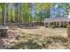 Expansive backyard with a patio, fenced area, and mature trees, perfect for outdoor activities at 65 Jacksons Vly, Sharpsburg, GA 30277