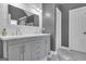 Bathroom featuring a double sink vanity, grey walls, white trim, and a white door at 65 Jacksons Vly, Sharpsburg, GA 30277