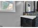Bathroom featuring a vanity with storage and a decorative tile backsplash and mirror at 65 Jacksons Vly, Sharpsburg, GA 30277
