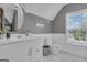 Bathroom with a toilet, sink, and a window letting in natural light at 65 Jacksons Vly, Sharpsburg, GA 30277