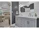 Bathroom with a double sink vanity and a view into the main bedroom at 65 Jacksons Vly, Sharpsburg, GA 30277