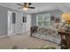 Bedroom with a ceiling fan, carpet, and a view into the ensuite bathroom at 65 Jacksons Vly, Sharpsburg, GA 30277
