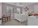 Comfortable bedroom with two windows, ceiling fan, lilac colored walls and neutral carpet at 65 Jacksons Vly, Sharpsburg, GA 30277
