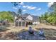 Charming backyard fire pit area with Adirondack chairs, perfect for cozy evenings and outdoor gatherings at 65 Jacksons Vly, Sharpsburg, GA 30277