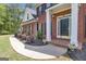 Close-up of front entrance showing well-maintained landscaping and a welcoming porch at 65 Jacksons Vly, Sharpsburg, GA 30277