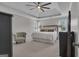 Main bedroom features neutral walls, carpet, ceiling fan and tray ceilings with two windows at 65 Jacksons Vly, Sharpsburg, GA 30277