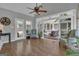 Bright sun room with hardwood flooring and access to a large screened-in porch at 65 Jacksons Vly, Sharpsburg, GA 30277