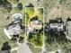 Aerial view of a home on a well-manicured lot with mature trees and neighboring homes at 110 Cadmium Ct, Peachtree City, GA 30269
