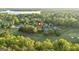 Scenic aerial perspective of a home nestled near a golf course and picturesque lake at 110 Cadmium Ct, Peachtree City, GA 30269