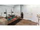 Finished basement with a home gym including weight rack and workout bench on dark laminate flooring at 110 Cadmium Ct, Peachtree City, GA 30269
