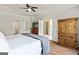 Spacious primary bedroom features a tray ceiling, hardwood floors, and ensuite bathroom access at 110 Cadmium Ct, Peachtree City, GA 30269