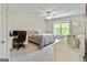Bedroom with a comfortable bed, a desk, and a bright window with backyard view at 110 Cadmium Ct, Peachtree City, GA 30269