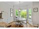 Bright breakfast nook featuring a bay window and views of the surrounding greenery at 110 Cadmium Ct, Peachtree City, GA 30269