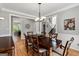 Elegant dining room with hardwood floors, wainscoting, and an open layout at 110 Cadmium Ct, Peachtree City, GA 30269