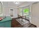 Bright dining room featuring hardwood floors, a bay window, and wainscoting at 110 Cadmium Ct, Peachtree City, GA 30269