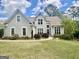 Stunning two-story home featuring a well-manicured lawn and charming landscaping at 110 Cadmium Ct, Peachtree City, GA 30269