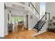 Spacious foyer featuring hardwood floors, staircase, and an open floor plan at 110 Cadmium Ct, Peachtree City, GA 30269