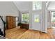 Grand foyer with hardwood floors, natural light, and a decorative accent table at 110 Cadmium Ct, Peachtree City, GA 30269