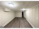 Basement with wood-look flooring and neutral walls at 668 Fielding Sw Ln, Atlanta, GA 30311